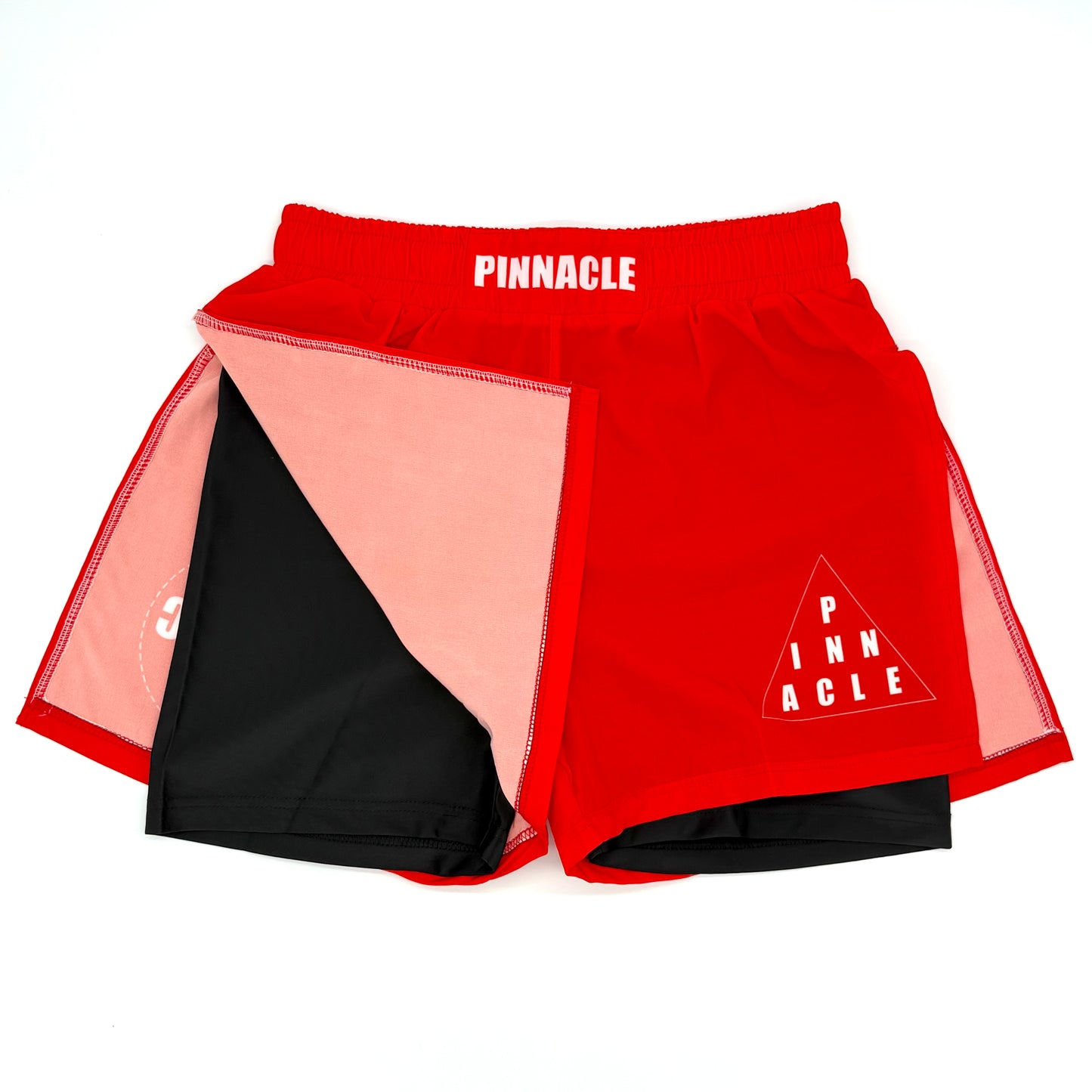 Red high-slit gladiator MMA shorts front view with built-in compression shorts exposed